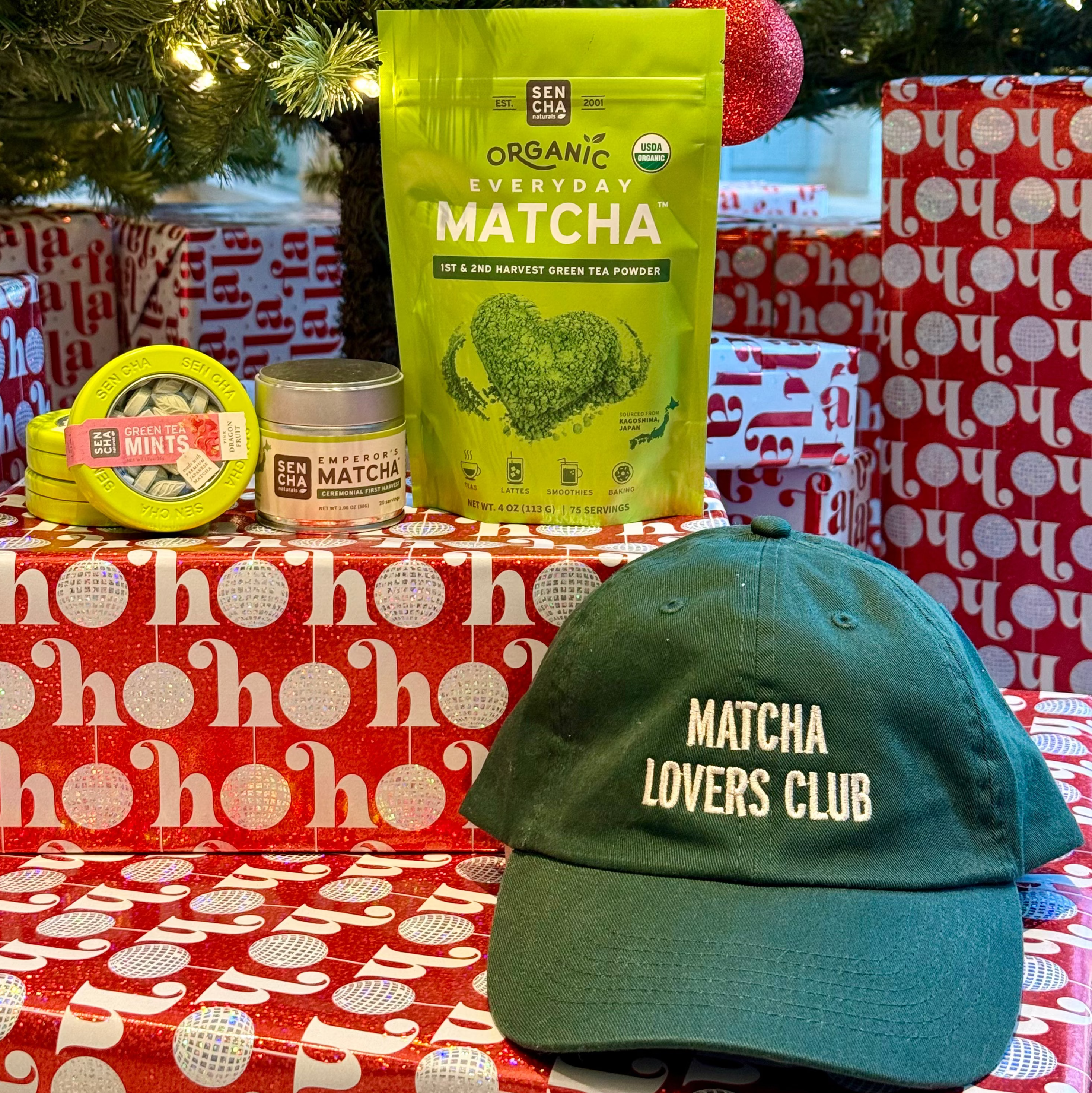 Matcha product and cap on a table with Christmas decorations in the background